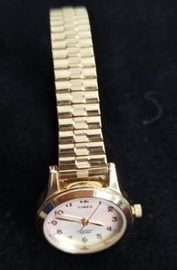 Timex gold tone watch with other of pearl face